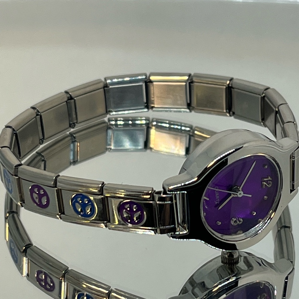 Adorable vibrant purple dial with peace signs on the band very pretty and fun!